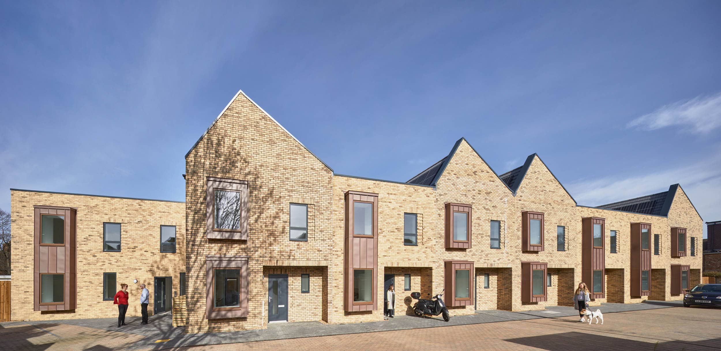 3d mock up of yellow brick housing outside view of street